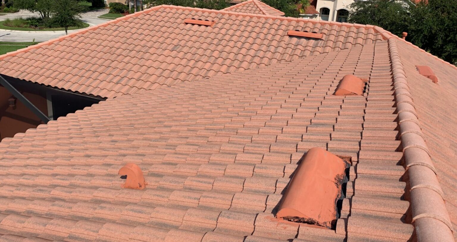 Tile roof with cracked and broken cap tiles